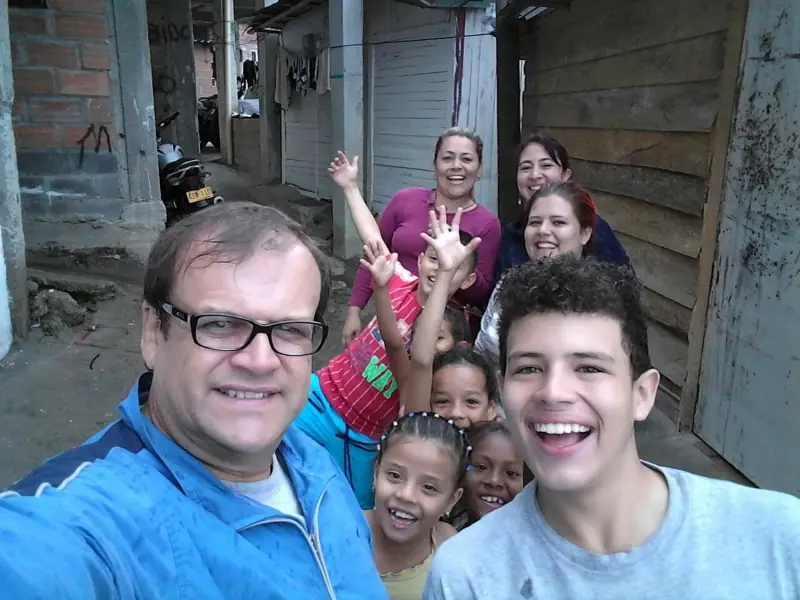 Center leaders with children during a neighborhood visit in 2016