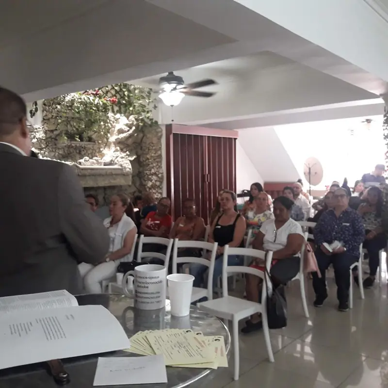 View from the speaker's table toward the audience in a hall