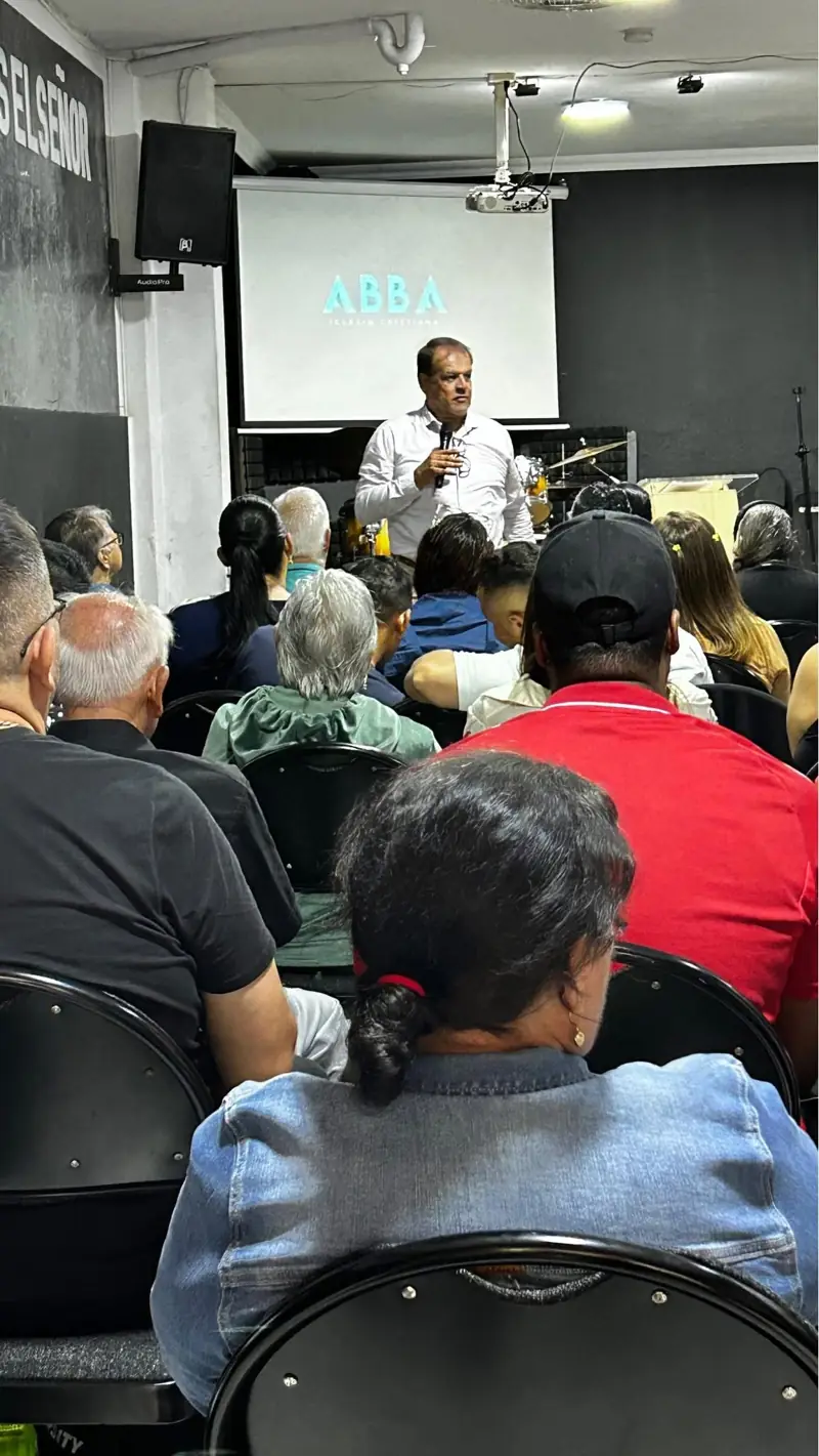 A teacher in front of a full room