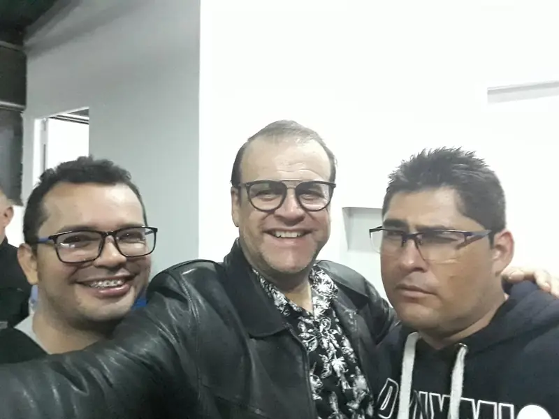Three men smiling in a selfie